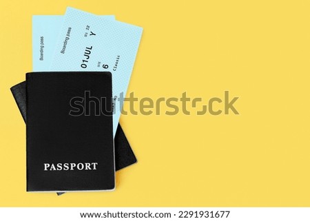 Black passports, flight boarding pass, airline tickets, airplane travel concept, passenger check in, customs control, border cross, summer holidays, vacation, international tourism banner, copy space