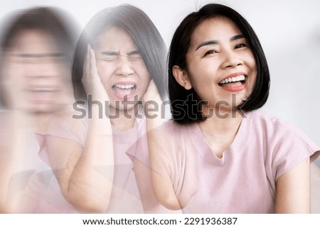 Bipolar Disorder concept with Asian woman's experience with swinging moods and mental health  Royalty-Free Stock Photo #2291936387