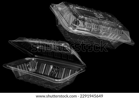 2 clear blank plastic mealbox on black background