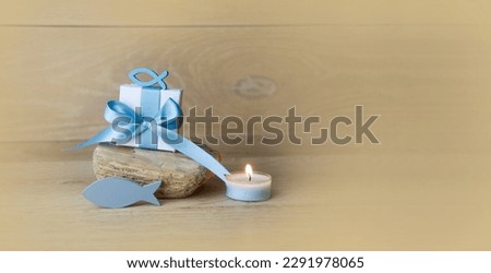 Confirmation, Communion and Baptism Greeting Card with Religious Fish Symbols - Gift box and burning candle - Maritime summer background banner and season decoration