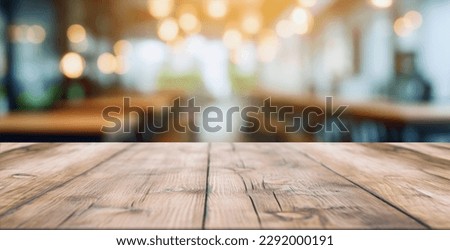 wood table on blur of cafe, coffee shop, bar, background - can used for display or montage your products Royalty-Free Stock Photo #2292000191