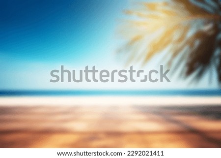 Blurred background, wooden table with a palm tree on the background of the sea. Copy space.