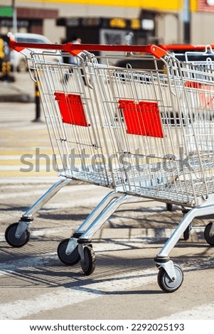 Empty shopping carts in shopping center parking. vertical. High quality photo
