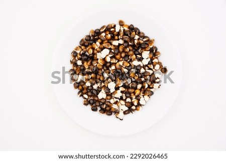 Overcooked burnt popcorn that is not good to eat 