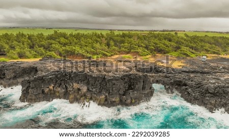 Pont Naturel, Mauritius Island. Beautiful arch rock formation from a drone viewpoint.