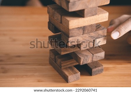 businessman playing wooden block. . Strategy, Planning and Risk concept.