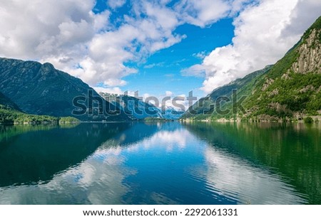 Amazing nature view with fjord and mountains. Beautiful reflection. Location: Scandinavian Mountains, Norway. Artistic picture. Beauty world. The feeling of complete freedom