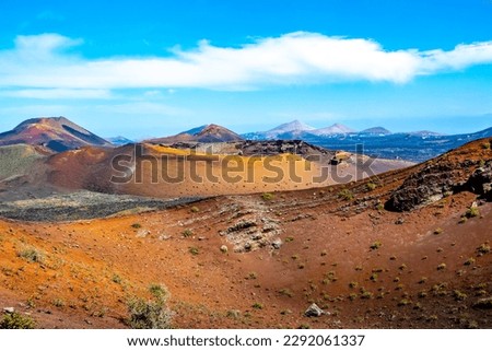 Amazing panoramic landscape of volcano craters in Timanfaya national park. Popular touristic attraction in Lanzarote island, Canary islans, Spain. Artistic picture. Beauty world.