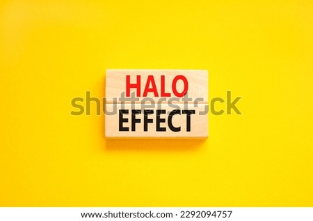 Halo effect and psychological symbol. Concept words Halo effect on beautiful wooden block. Beautiful yellow table yellow background. Business psychological and Halo effect concept. Copy space.