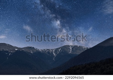 Beautiful night landscape,  mountains and hills in the starry night with milky way galaxy.