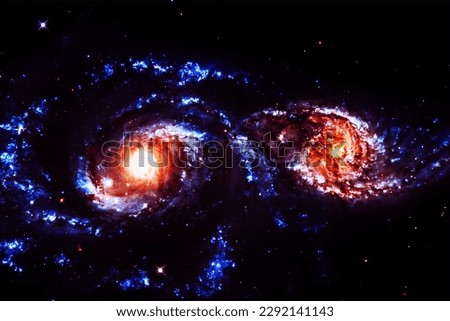 Two galaxies in space on a dark background. Elements of this image furnished NASA. High quality photo