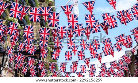 Union Jack flags hanging at the street ready to national holiday celebration Royalty-Free Stock Photo #2292156259