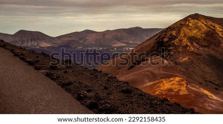 Amazing panoramic landscape of volcano in Timanfaya national park. Popular touristic in Lanzarote island Canary islans Spain. Artistic picture. Travel concept.