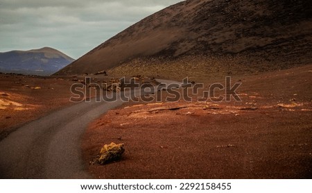 Amazing panoramic landscape of volcano in Timanfaya national park. Popular touristic in Lanzarote island Canary islans Spain. Artistic picture. Travel concept.