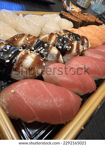 Sushi in package. Tuna salmon eel scallops are on picture.