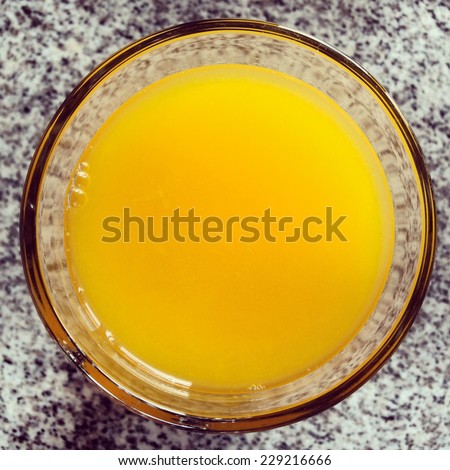 A glass of orange juice from above. Fresh, delicious and round circle shape.