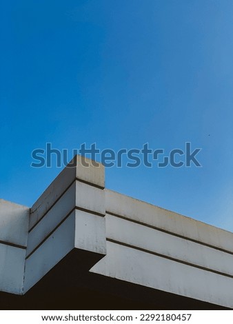 Minimalism photography of clean blue sky over concrete building