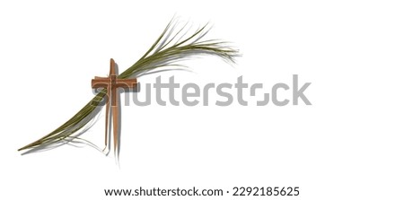 Palm Sunday. A photo of a crucifix made of dry palm over a green branch of palm leaves. There's a lot of space at right side of the shot to put text, other symbols or to crop as you like.