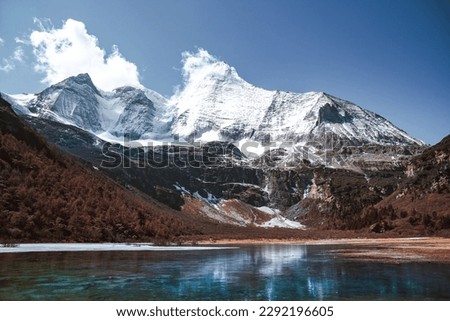 Daocheng yading scenic spot(inagi aden),in Sichuan,China National Nature Reserve,whit Blue lake, snow mountain valley, Tibetan temple. Royalty-Free Stock Photo #2292196605