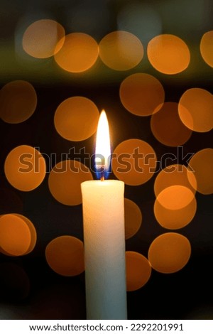 Many burning candles with shallow depth of field, on dark surface. Memory day. Selective focus.