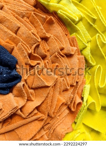 abstract background from yellow, orange, black cloth