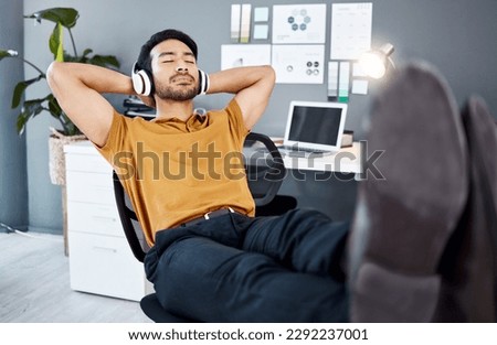 Business office, relax music and man finished with task, listening to calm podcast or radio audio sound. Streaming headphones, mental health and easy worker, employee or male agent done with work Royalty-Free Stock Photo #2292237001