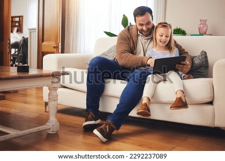 Father, child and a tablet for learning in a family home while happy and excited for education internet. A man or dad and girl kid on the sofa for streaming, mobile app and website for development