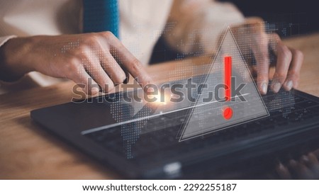 Programmer and virtual icons , exclamation mark ,alarm,computer virus detected ,danger warning concept or information error that should be urgently fixed and repaired ,Notification of security issues  Royalty-Free Stock Photo #2292255187