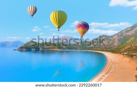 Hot air balloon flying over spectacular oludeniz (ölüdeniz) lagoon - Fethiye, Turkey Royalty-Free Stock Photo #2292260017
