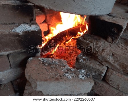 Fire on hand made temporary fire place with Wood