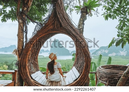 Summer vacation concept, asian female traveler enjoying vacation in beautiful view cafe at Phangnga ,Thailand Royalty-Free Stock Photo #2292261407
