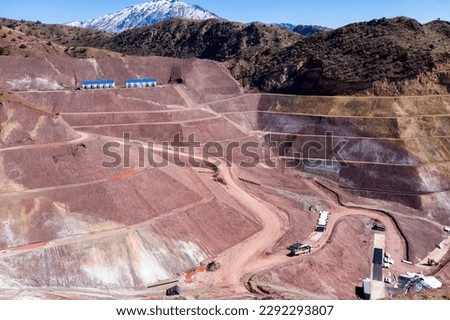 View of the industrial mine waste dam (tailing dam). A tailings dam is typically an earth-fill embankment dam used to store byproducts of mining operations after separating the ore from the gangue. Royalty-Free Stock Photo #2292293807