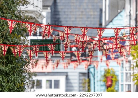 Union flag bunting in the town of Maldon in Essex, UK.  The bunting has been put up in preparation for the Coronation of Kings Charles III. Royalty-Free Stock Photo #2292297097