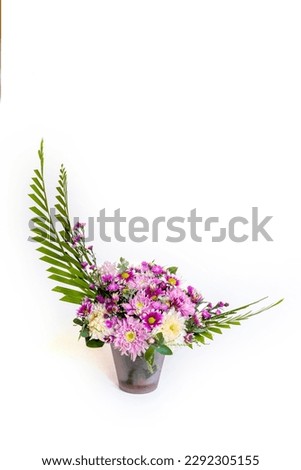 Beautiful flower arrangement with the basic shape of the crescent moon with a white background. Royalty-Free Stock Photo #2292305155