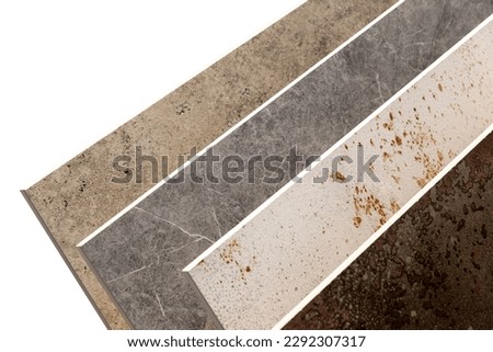 Samples of a ceramic tile in shop. Colored samples of ceramic tiles for kitchen or bathroom interior material design of house, floor, porcelain stoneware. Royalty-Free Stock Photo #2292307317