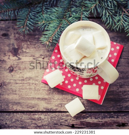 Winter cozy background with Marshmallow in the Cup of coffee.Cozy sweet Christmas background 