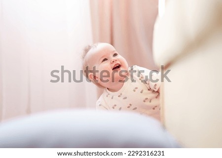 Portrait of a cute Caucasian baby toddler with first tooth