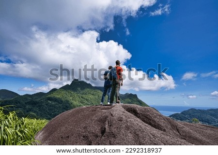 Copolia trail Couple on the top part of the copolia trail looking at down at town Victoria, Mahe Seychelles  Royalty-Free Stock Photo #2292318937