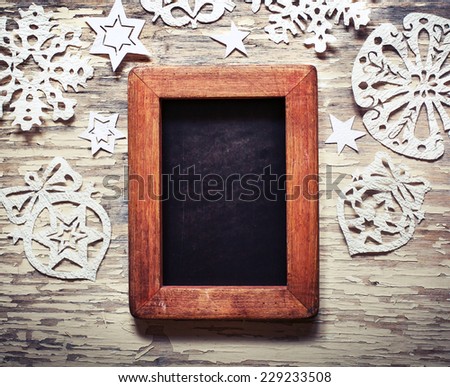 Christmas background with snowflakes and  framed blackboard