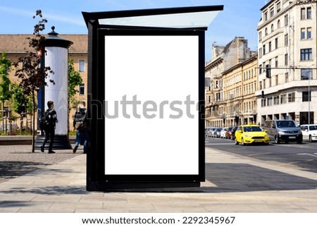 bus shelter at busstop. transit station. blank white billboard ad sign and lightbox. bus shelter advertising. soft background. glass and aluminum structure. white poster ad commercial poster display Royalty-Free Stock Photo #2292345967