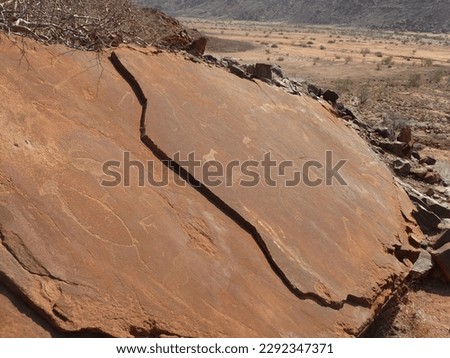 namibia desert animal painting wall famous unesco Twyfelfontein rock mountain red orange