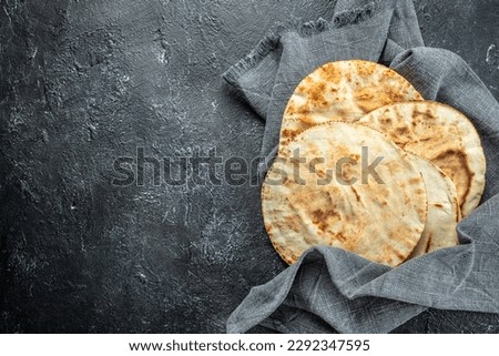 fresh pita tortillas, bread. anner, menu recipe place for text, top view. Royalty-Free Stock Photo #2292347595