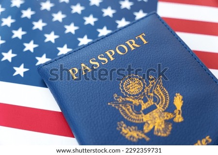 New Blue United States of America Passport on US Flag background . concept of obtaining US citizenship. A citizen of the United States. Royalty-Free Stock Photo #2292359731