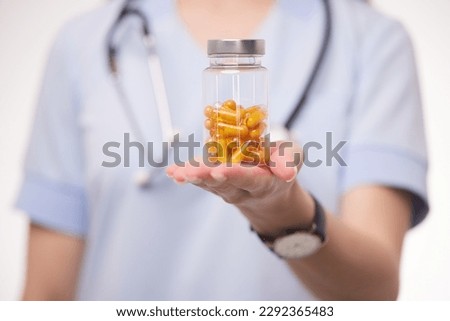 doctor holding a transparent pill in his hands close-up