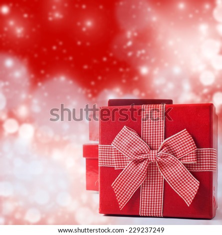 Red Christmas present on bokeh background