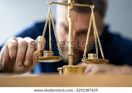 Money Coins Balance, Compare And Protection On Weigh Scales Royalty-Free Stock Photo #2292387659
