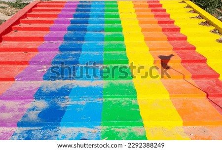 Colorful rainbow stairs. Stairs up from well in one of tourist attractions in Thailand. Rainbow is symbol LGBTQ is term used to refer to people of different genders. LGBTQ is diverse group of people.