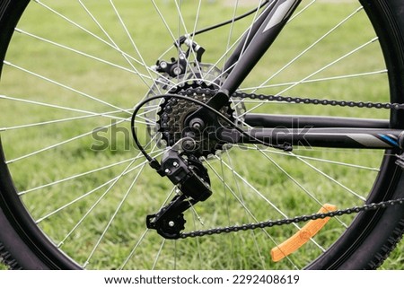Bicycle gears, disc brake and rear derailleur. The switches are on the steering wheel