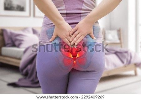 Tailbone pain, coccyx fracture, woman suffering from coccygodynia at home, health problems concept Royalty-Free Stock Photo #2292409269