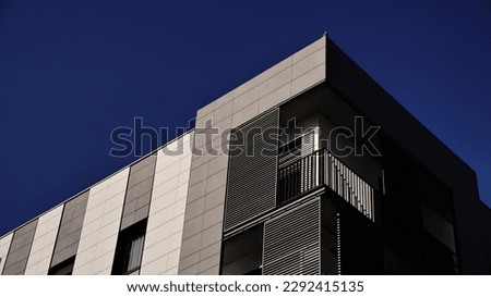 corner of the facade of a modern urban residential building Royalty-Free Stock Photo #2292415135